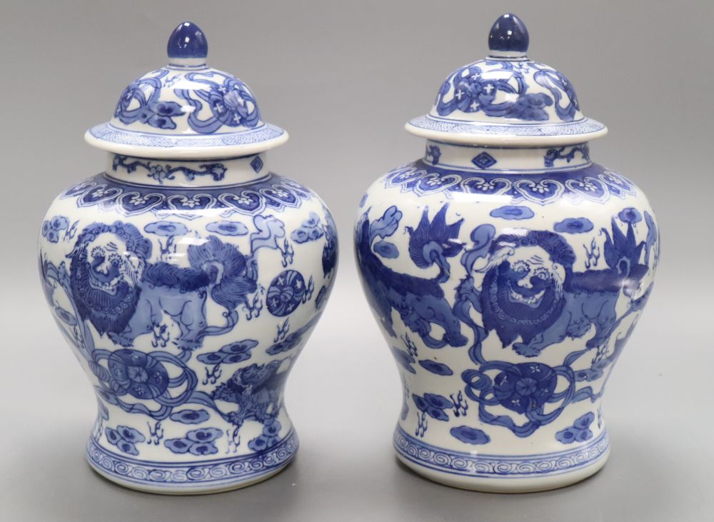 A pair of Chinese blue and white dragon vases, height 26cm